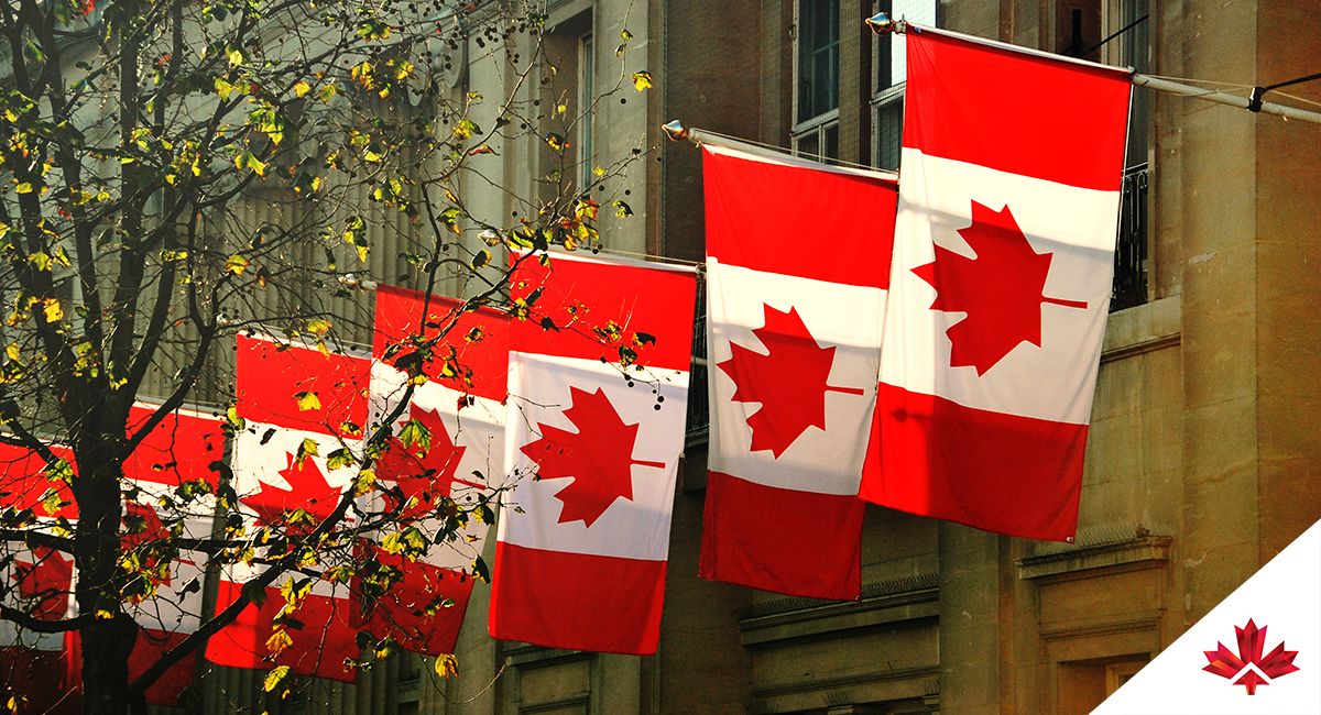 row of Canada flags on building