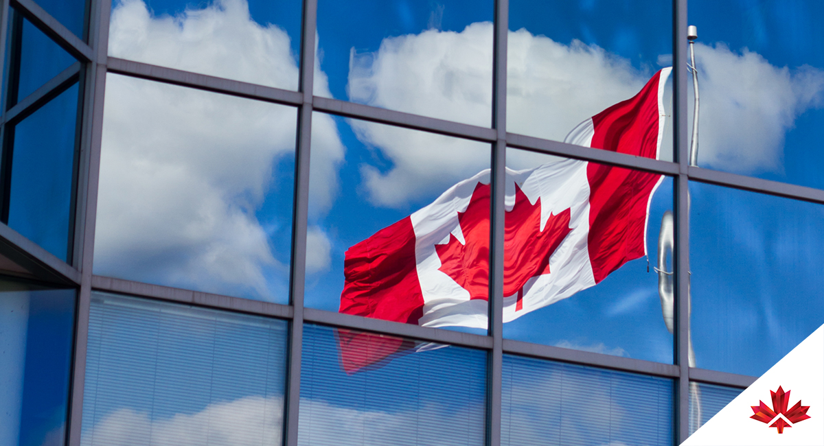 Canada flag reflected in office building