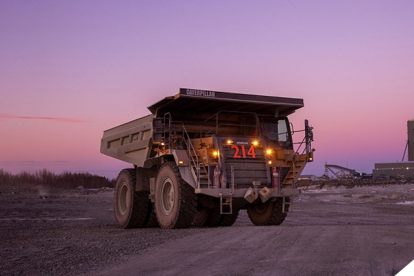 Large dumptruck in mine during sunset