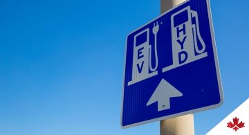 street sign indicating electric and hydrogen stations ahead