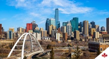 Edmonton (Alberta) downtown skyline showing Walterdale Bridge across Saskatchewan River and surrounding skyscrapers. 